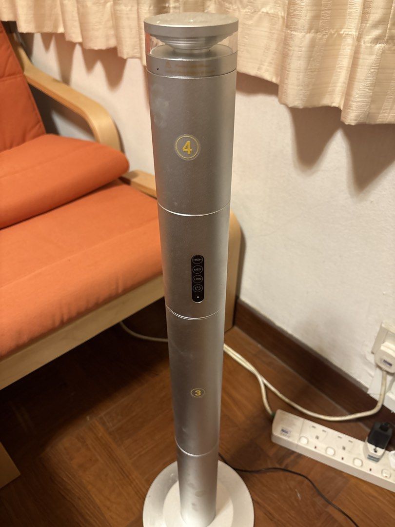 Diffuser with Remote Control (Category: Home Fragrance) located in Singapore. Submitted by mystique766 (Listing ID 1470085025, Image 2). Description: - Tall silver tower fan, fully functional and ready to use - 3 speed settings: Low, Medium, High - Remote control included with timer options (2H, 4H, 8H, 12H) and light button - Space-saving modern column design fits easily into corners - Standard wall plug-in - free liquid scent.