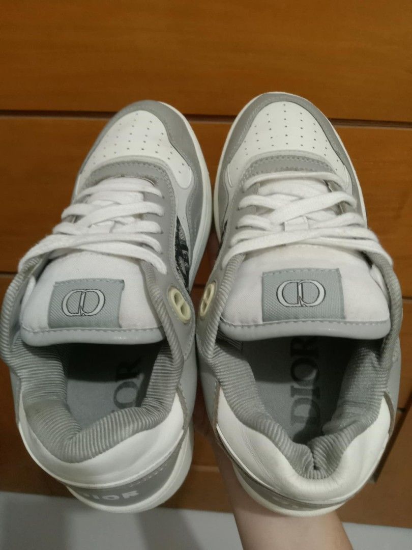 Dior B27 Low-Top Sneaker Grey White Oblique (Category: Sneakers & Footwear) located in Manila. Submitted by viernz_rose (Listing ID 1469991046, Image 2). Description: - Brand: Dior B27 Low-Top Sneakers - Colorway: Grey and White - Design: Iconic Dior oblique jacquard panels with premium leather upper - Comfort & Details: Perforated toe box, rubber sole, and CD logo lace eyelets/tongue patch - Branding: Embossed DIOR logo on midsole and heel tab -