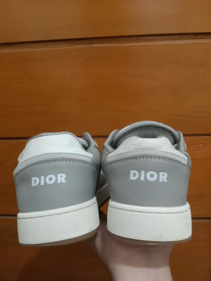 Dior B27 Low-Top Sneaker Grey White Oblique (Category: Sneakers & Footwear) located in Manila. Submitted by viernz_rose (Listing ID 1469991046, Image 3). Description: - Brand: Dior B27 Low-Top Sneakers - Colorway: Grey and White - Design: Iconic Dior oblique jacquard panels with premium leather upper - Comfort & Details: Perforated toe box, rubber sole, and CD logo lace eyelets/tongue patch - Branding: Embossed DIOR logo on midsole and heel tab -