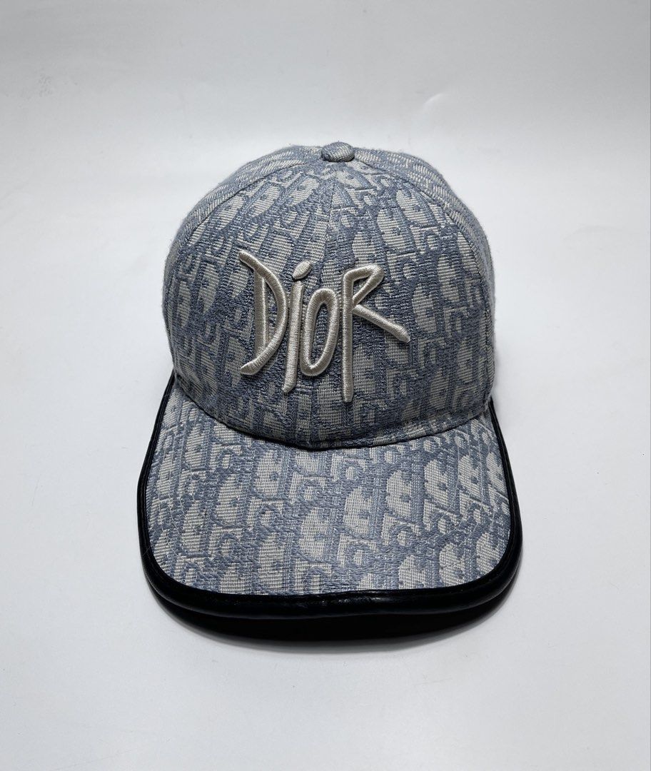 Dior Oblique Blue Monogram Baseball Cap (Category: Caps & Hats) located in Iloilo. Submitted by fromthebins.ilo2 (Listing ID 1470106399, Image 1). Description: - Dior Oblique monogram jacquard baseball cap in blue and grey - White embroidered Dior signature logo on the front - Premium black leather-trimmed curved brim - Adjustable back strap with branded metallic hardware - Grey interior lining with original care tag attached - Condition: Excelle