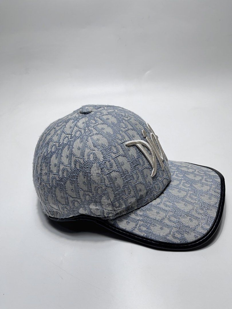 Dior Oblique Blue Monogram Baseball Cap (Category: Caps & Hats) located in Iloilo. Submitted by fromthebins.ilo2 (Listing ID 1470106399, Image 2). Description: - Dior Oblique monogram jacquard baseball cap in blue and grey - White embroidered Dior signature logo on the front - Premium black leather-trimmed curved brim - Adjustable back strap with branded metallic hardware - Grey interior lining with original care tag attached - Condition: Excelle