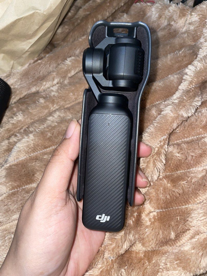 DJI Osmo Pocket 3 Standard Combo Camera (Category: Cameras) located in Catarman. Submitted by dclutter.vi (Listing ID 1470112994, Image 1). Description: - Item: DJI Osmo Pocket 3 Handheld Camera - Condition: Excellent - Video Quality: Smooth 4K resolution with 3-axis mechanical gimbal stabilization - Display: Rotating touchscreen for easy horizontal and vertical shooting - Included: Protective case with built-in extra filter slots - Perfect for: 
