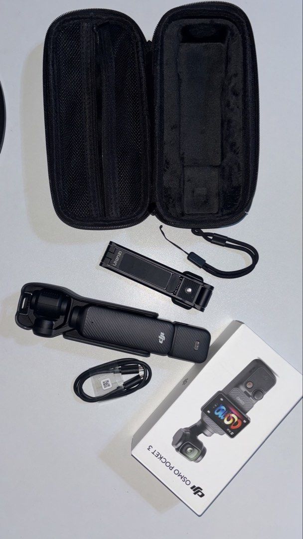 DJI Osmo Pocket Standard Combo (Category: Cameras) located in Batangas. Submitted by sheenacolendres03 (Listing ID 1470079608, Image 1). Description: - Item: DJI Osmo Pocket 3 camera setup - Condition: Excellent, complete with original box - Inclusions: Protective carry case, charging cable, wrist strap, and Ulanzi accessory mount - Status: Like new, 1 month lang nagamit - RFS: need funds - Can do meet up around SM Calamba and SM Sta Rosa.