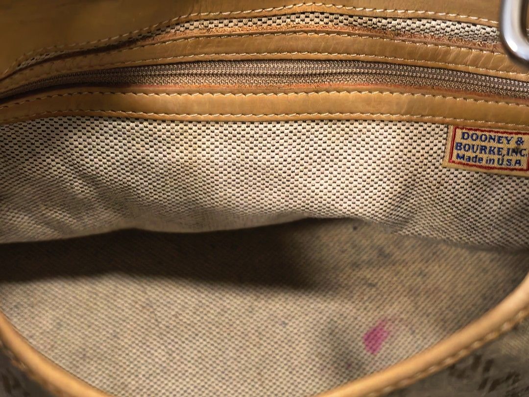 Dooney & Bourke Monogram Canvas Shoulder Bag (Category: Luxury Bags & Wallets) located in Cagayan de Oro. Submitted by pootx (Listing ID 1470091542, Image 3). Description: -please check the last photo sa issue - Authentic Dooney & Bourke shoulder bag - Khaki monogram canvas with durable tan leather trim and base - Secure front strap with classic turn-lock closure - Shiny silver-tone hardware and protective metal feet - Spacious interior lined wit