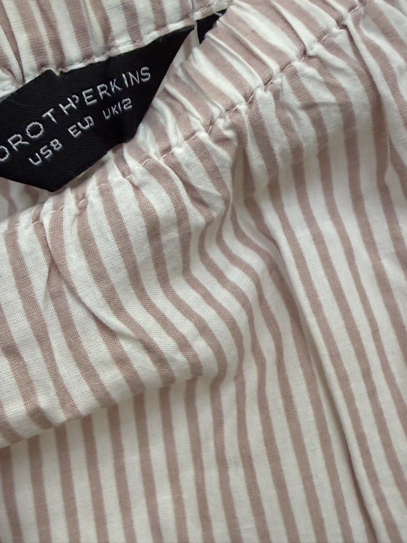 Dorothy Perkins Striped Off-Shoulder Blouse (Category: Blouses) located in Quezon City. Submitted by reivia.vend (Listing ID 1469985823, Image 2). Description: - Brand: Dorothy Perkins - Design: Pink & white vertical stripes with white embroidery on sleeves and hem - Style: Off-shoulder with elasticated neckline and flared sleeves - Size: US 8, EU 36, UK 12 - Material: Lightweight and comfortable fabric - Condition: Excellent / Ready to wear.