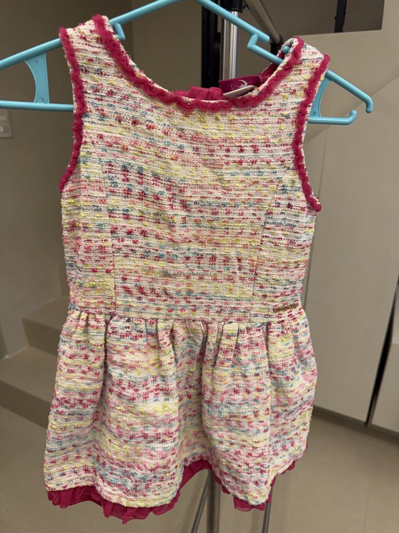 DreamWorks Trolls Multi-Colored Tweed Dress (Category: Dresses) located in Manila. Submitted by __nix (Listing ID 1470009471, Image 1). Description: - Brand: Official DreamWorks Trolls - Material: Multi-colored textured tweed woven with pink, yellow, and blue threads - Design: Dark pink ruffled trim on neckline and armholes, dropped waist with flared pleated skirt - Closure: Exposed gold-tone zipper at the back - Hem: Pink ruffle hem lining - Con