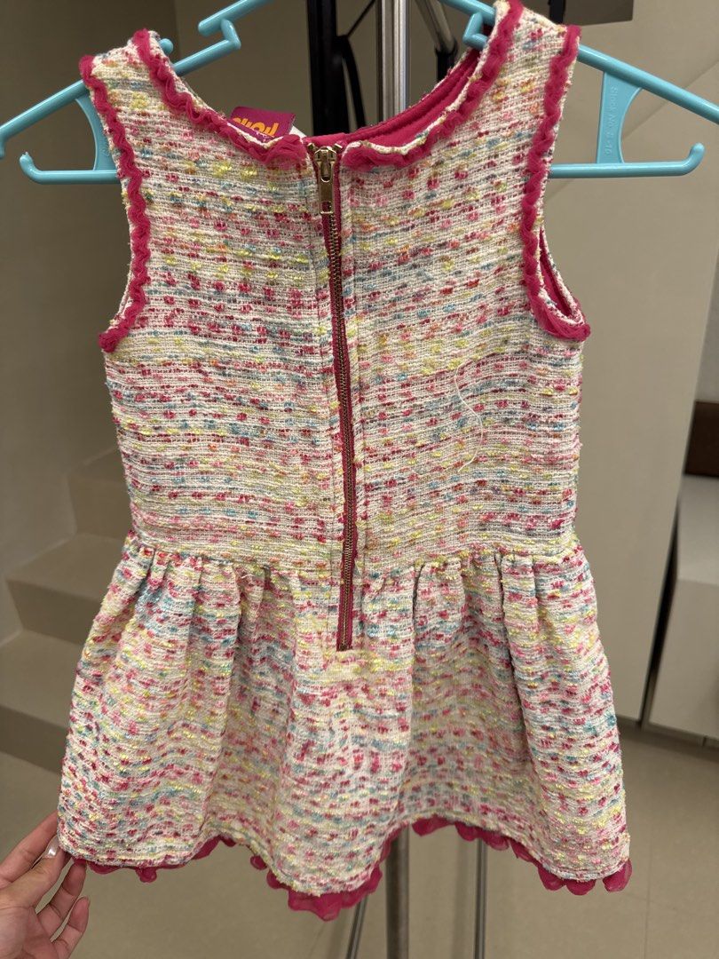 DreamWorks Trolls Multi-Colored Tweed Dress (Category: Dresses) located in Manila. Submitted by __nix (Listing ID 1470009471, Image 2). Description: - Brand: Official DreamWorks Trolls - Material: Multi-colored textured tweed woven with pink, yellow, and blue threads - Design: Dark pink ruffled trim on neckline and armholes, dropped waist with flared pleated skirt - Closure: Exposed gold-tone zipper at the back - Hem: Pink ruffle hem lining - Con
