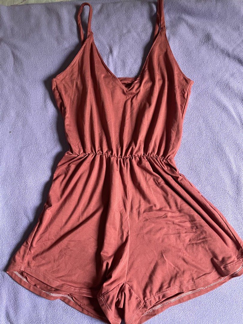 Dusty Rose Spaghetti Strap Romper (Category: Rompers) located in Antipolo. Submitted by chicgrc (Listing ID 1469967359, Image 1). Description: - Color: Dusty Rose - Design: Thin spaghetti straps, V-neckline, and shorts style - Fit: Elastic waistband with a gathered, flowy silhouette - Fabric: Soft, lightweight, and breathable - Perfect for: Hot summer days, beach trips, or cozy lounging at home.