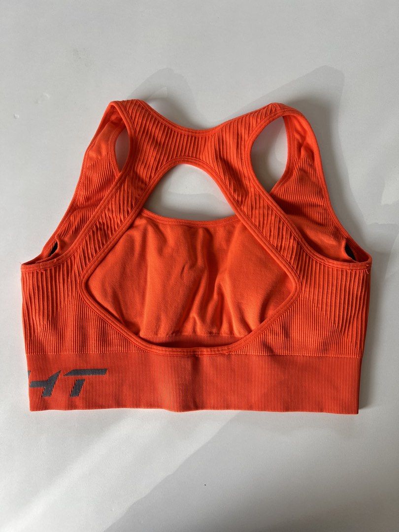 Echt Sports Bra (Category: Activewear) located in Santiago. Submitted by riceavllnz (Listing ID 1469956186, Image 2). Description: 🧡 Bold orange workout top with a stylish racerback design — perfect for adding a pop of color to your gym wardrobe! • Brand: Echt • Color: Bright orange • Style: Racerback sports bra • Design: Ribbed texture with wide elasticated underband • Detail: Black logo accents • Can fit up to Semi-Med Perfect for gym sessions