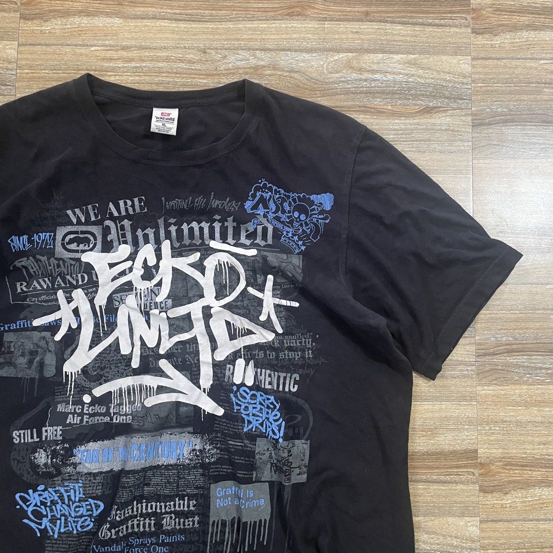 Ecko Unltd Graffiti Print Black T-Shirt XL (Category: Tshirts & Polo Shirts ) located in Cebu City. Submitted by trashloots.ceb (Listing ID 1469971421, Image 2). Description: VINTAGE Y2K ECKO‼️ EXCELLENT Size: XL W 24/ L30 COLORATE 9.5/ 10 ISSUE : Crack Prints PRICE + SF🛒🛒 📍CEBU , SAN FERNANDO 🚚 J&T EXPRESS.
