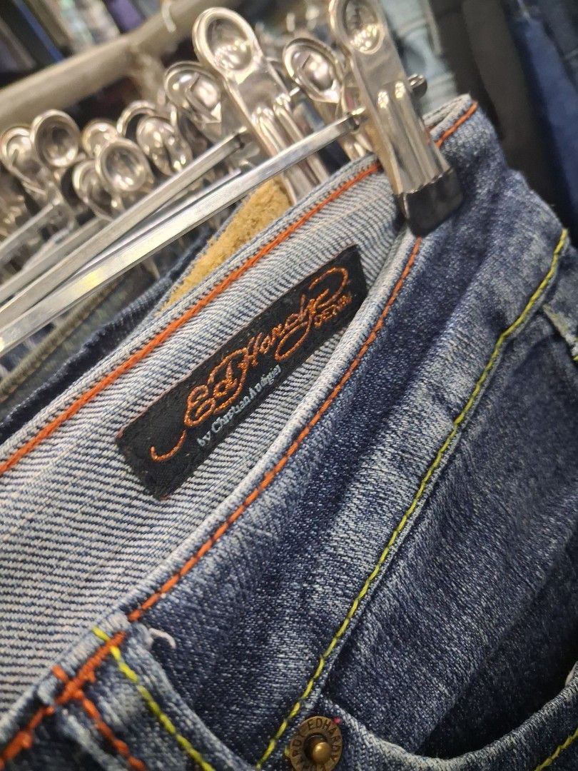 Ed Hardy Skull Denim Jeans y2k (Category: Jeans) located in Manila. Submitted by zafi_ (Listing ID 1470071554, Image 2). Description: - Brand: Ed Hardy - Style: Classic straight leg denim jeans with regular rise - Wash: Classic blue wash - Design: Detailed 'Kills Slowly' skull embroidery on the back pocket - Details: Multi-colored contrast stitching, branded buttons, and interior waistband label - Vibe: Ultimate vintage Y2K streetwear piece - Con