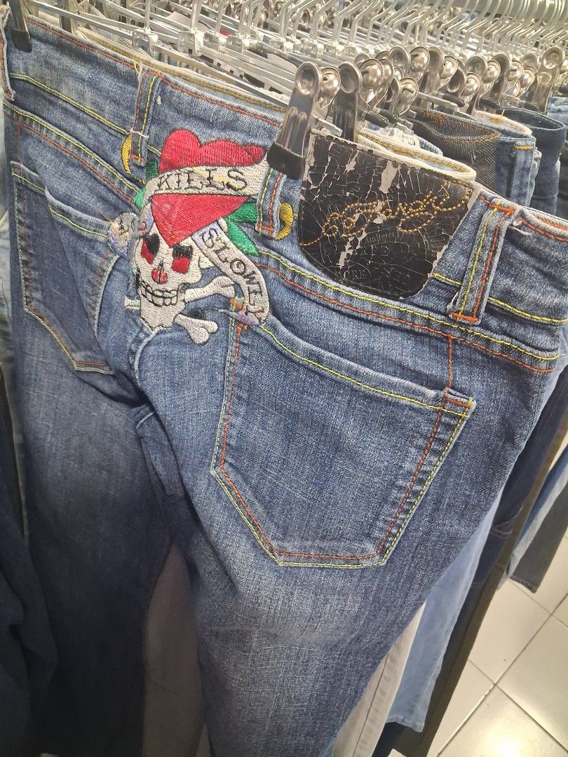 Ed Hardy Skull Denim Jeans y2k (Category: Jeans) located in Manila. Submitted by zafi_ (Listing ID 1470071554, Image 1). Description: - Brand: Ed Hardy - Style: Classic straight leg denim jeans with regular rise - Wash: Classic blue wash - Design: Detailed 'Kills Slowly' skull embroidery on the back pocket - Details: Multi-colored contrast stitching, branded buttons, and interior waistband label - Vibe: Ultimate vintage Y2K streetwear piece - Con