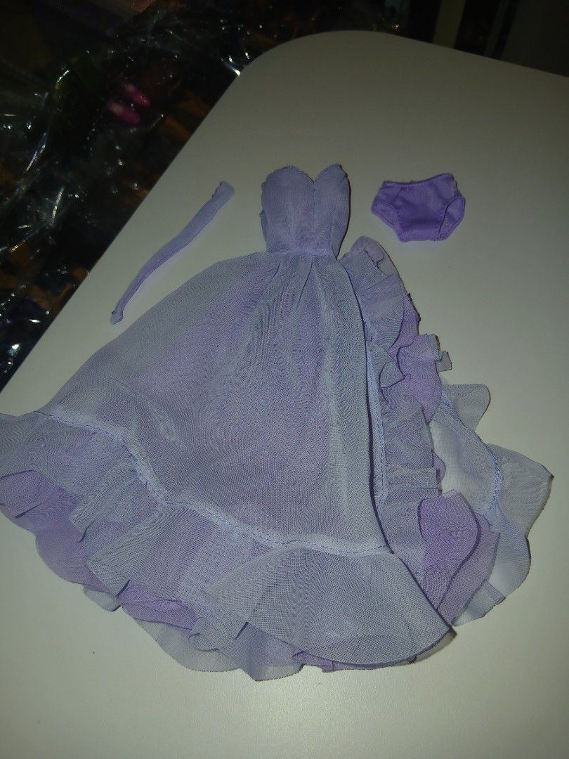 Elizabeth taylor gown (code C) (Category: Kids Toys) located in Subic. Submitted by frncnjntmr22 (Listing ID 1470125528, Image 1). Description: - Color: Light Purple - Material: Soft, high-quality mesh - Set includes: Ruffled dress with layered skirt, matching underwear, and thin strap accessory - Condition: Brand new - Perfect for: Doll dress-up games, photography, and collectors - Mode of Payment: Gcash / BPI accepted - Shipping: Fast ship-out 