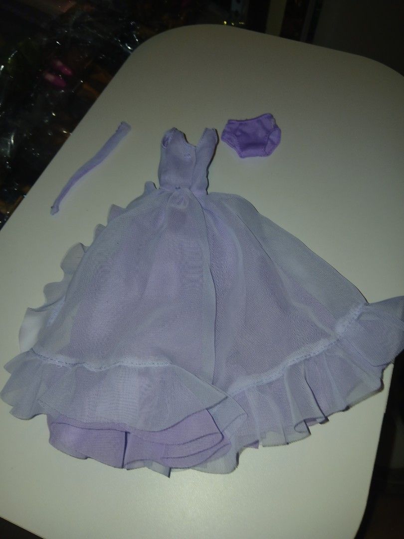 Elizabeth taylor gown (code C) (Category: Kids Toys) located in Subic. Submitted by frncnjntmr22 (Listing ID 1470125528, Image 2). Description: - Color: Light Purple - Material: Soft, high-quality mesh - Set includes: Ruffled dress with layered skirt, matching underwear, and thin strap accessory - Condition: Brand new - Perfect for: Doll dress-up games, photography, and collectors - Mode of Payment: Gcash / BPI accepted - Shipping: Fast ship-out 