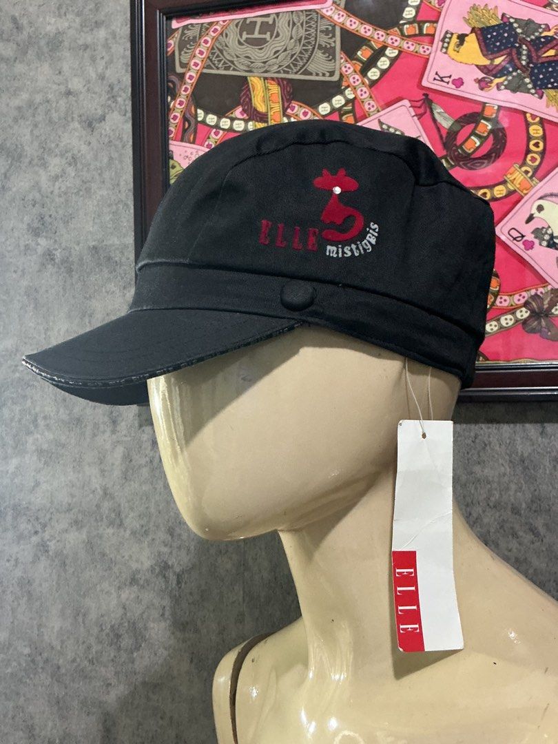Elle mistigris cadet cap style (Category: Coats, Jackets and Outerwear) located in Angeles City. Submitted by goodbuysathome (Listing ID 1469948838, Image 1). Description: This piece is an official ELLE Mistigris black cotton cadet work cap. Mistigris” collection from ELLE features their signature stylized red cat embroidery emblem alongside the brand logo. This specific piece is a deadstock or brand-new item complete with its original red and wh
