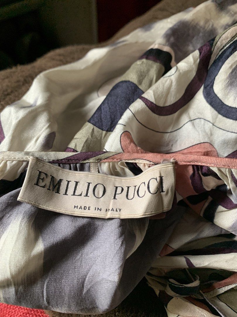 Emilio Pucci Silk Printed Dress Modello 47RM91 (Category: Dresses) located in Cebu City. Submitted by selamethrift (Listing ID 1470062894, Image 2). Description: - 100% Authentic Emilio Pucci printed silk dress, Made in Italy - Luxurious 100% silk fabric with the iconic signature Pucci pattern in muted purple, pink, black, and beige - Features a chic drawstring neckline with branded gold-tone metal aglets and long sleeves - Model: 47RM91 | Fabric