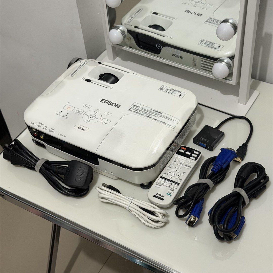 Epson EB-S12 LCD Projector | With Bag + FREE HDMI Adapter (Category: Projectors) located in Valenzuela. Submitted by declutterwithmrll (Listing ID 1437645270, Image 2). Description: Selling my preloved Epson EB-S12 projector. Not used often and well-kept. Perfect for presentations, movie nights, and home use. Location: Valenzuela City Inclusions: Epson EB-S12 projector Power cord Carrying bag FREE HDMI connector Basic Specifications: Projection t