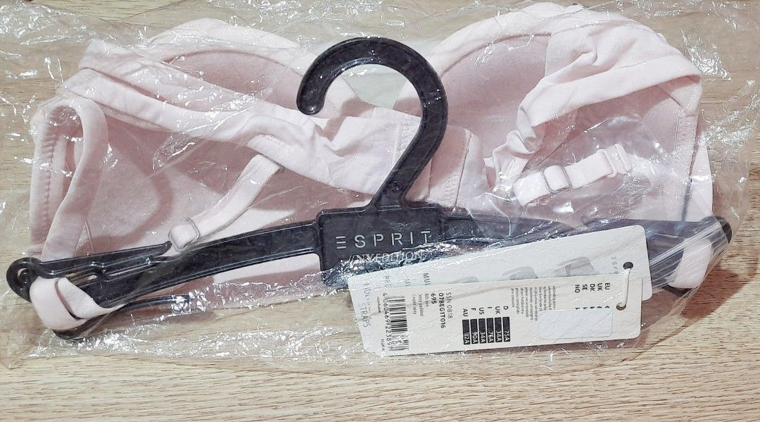 Esprit Pink Light Padded Underwire Bra (Category: Undergarments & Loungewear) located in Manila. Submitted by crejzshoppe (Listing ID 1470012935, Image 2). Description: > Size 34A as per tag but the band length seems like 32 Cup B. It's too tight for 34, You need to use an extender > Light padded - Brand: Esprit (Authentic bought in France) - Color: Light pink with a subtle zig-zag texture - Support: Padded cups with underwire - Features: Adjusta
