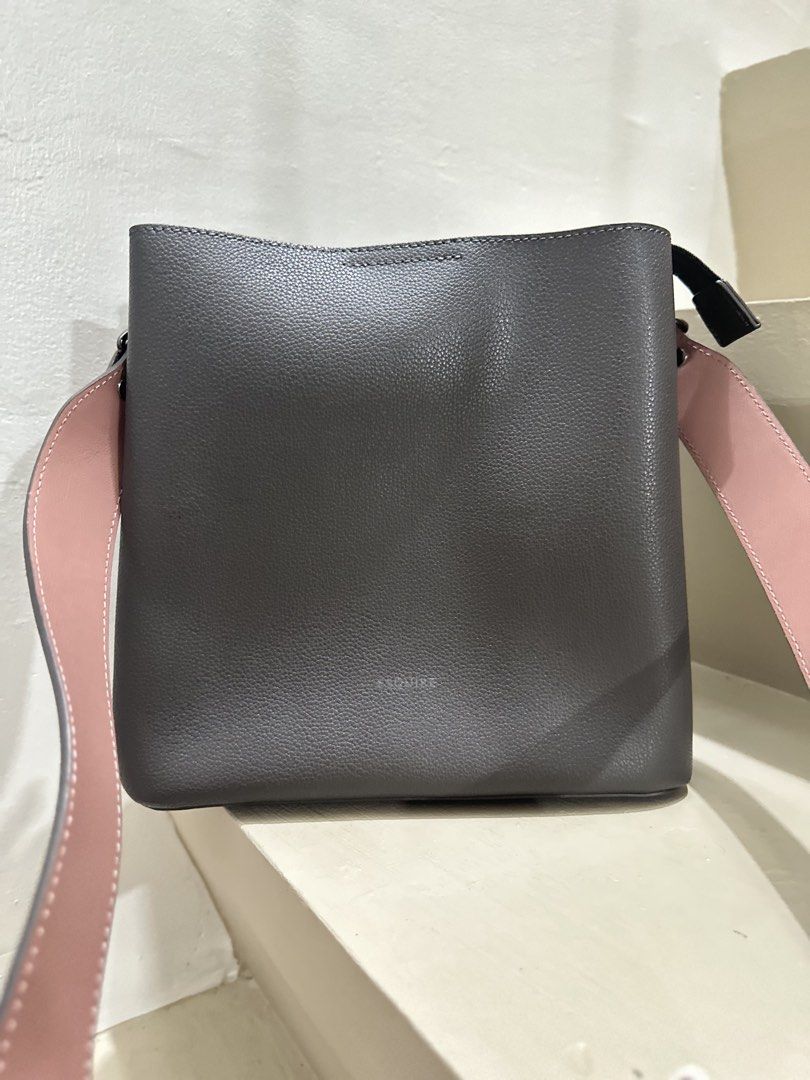 Esquire Grey Bucket Bag with Pink Strap (Category: Shoulder Bags) located in General Trias. Submitted by anjmp (Listing ID 1470134543, Image 1). Description: - Brand: Esquire ✅ almost new ✅ no issues, super ganda ng leather Sulit na sulit ‘to .
