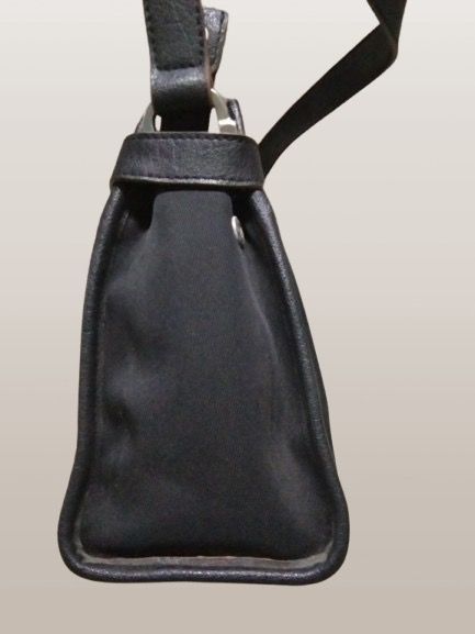 ETIENNE AIGNER BLACK LEATHER BAG (Category: Cross-body Bags) located in Marikina City. Submitted by minimalistmanila (Listing ID 1470003613, Image 3). Description: Etienne Aigner black bag. Mix of leather and canvass. 3 compartments. Medium size. Never used. Worth P2,999. Order now!.