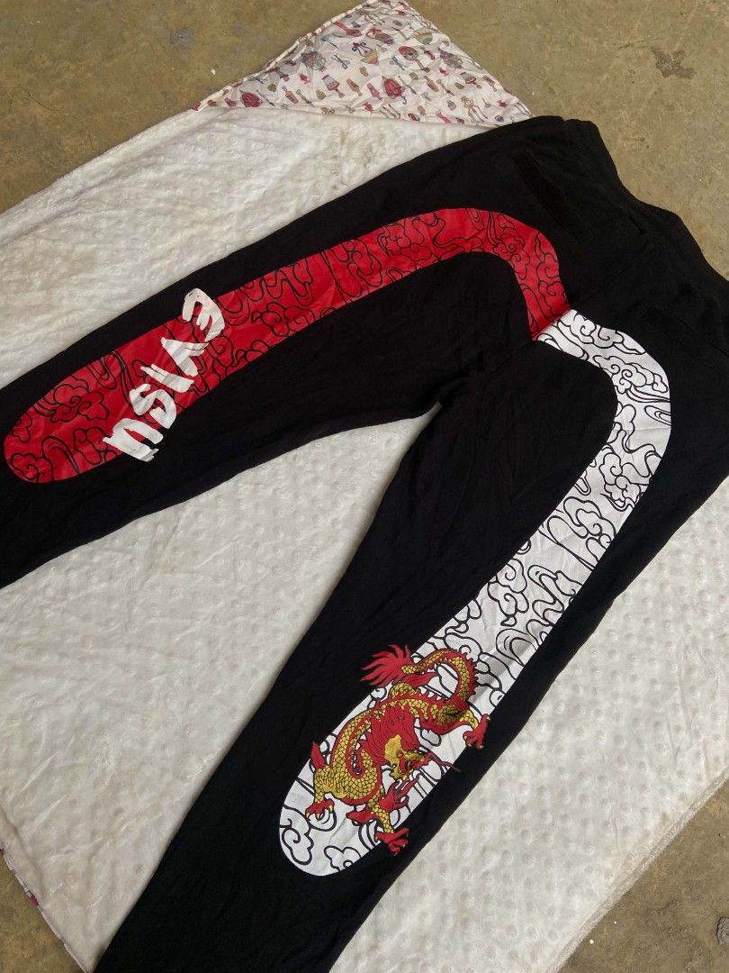 Evisu Daicock Jogger Pants, (Category: Joggers) located in Lianga. Submitted by arwthrifts (Listing ID 1470068796, Image 3). Description: EVISU DAICOCK EXCELLENT CONDITION NO ISSUE NO CRACK PRINTS 9.7/10 COLOR RATE DIMES: 30-34 W 40 L.