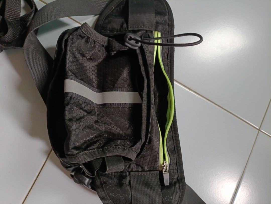 Exercise pouch (Category: Belt bags, Clutches and Pouches) located in Singapore. Submitted by ahpong999 (Listing ID 1470024039, Image 1). Description: - Type: Exercise pouch / running waist bag - Color: Black with neon green zipper accents - Material: Durable honeycomb pattern fabric - Features: Secure zip compartments, reflective safety strip for night visibility, adjustable strap - Condition: Excellent - Delivery: Meetup at Yew Tee or Raffles P
