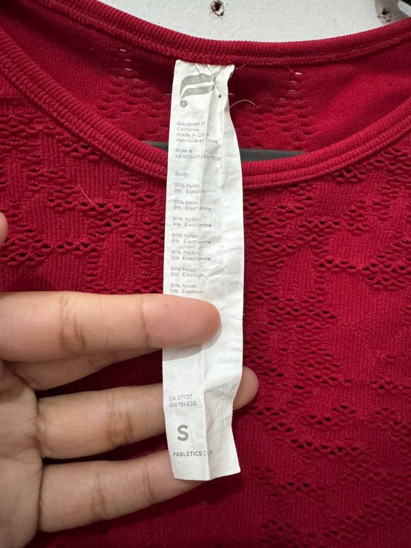 Fabletics Red Seamless Long Sleeve Top Size S (Category: Longsleeves) located in Santa Rosa. Submitted by sherikasstuff (Listing ID 1469958429, Image 2). Description: - Brand: Fabletics - Item: Seamless Long Sleeve Top - Color: Bright Red - Size: Small - Details: Textured knit pattern on chest and sleeves, crew neckline, ribbed hem and cuffs - Material: Stretchy and comfortable fabric - Condition: Clean, worn only a few times - Best for: Aerial w
