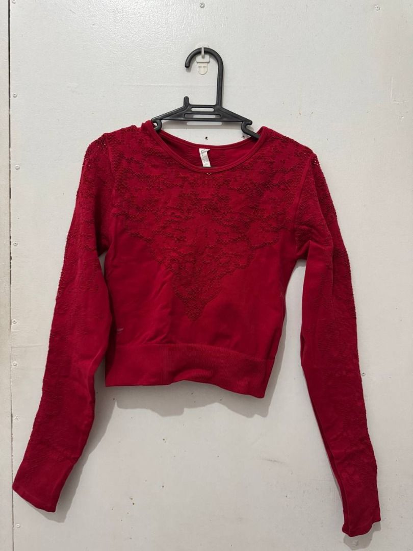 Fabletics Red Seamless Long Sleeve Top Size S (Category: Longsleeves) located in Santa Rosa. Submitted by sherikasstuff (Listing ID 1469958429, Image 3). Description: - Brand: Fabletics - Item: Seamless Long Sleeve Top - Color: Bright Red - Size: Small - Details: Textured knit pattern on chest and sleeves, crew neckline, ribbed hem and cuffs - Material: Stretchy and comfortable fabric - Condition: Clean, worn only a few times - Best for: Aerial w