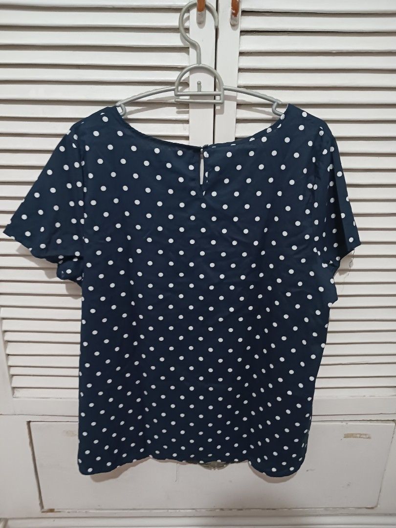 Faded Glory Navy Blue Polka Dot Blouse XXL (Category: Blouses) located in Quezon City. Submitted by rdonelle (Listing ID 1470081888, Image 3). Description: - Brand: Faded Glory - Design: Navy blue with white polka dots - Size: XXL (20) - Material: 100% lightweight polyester - Sleeves: Short sleeves - Closure: Easy slip-on with back keyhole button - Condition: Comfort fit, ideal for casual daily wear.