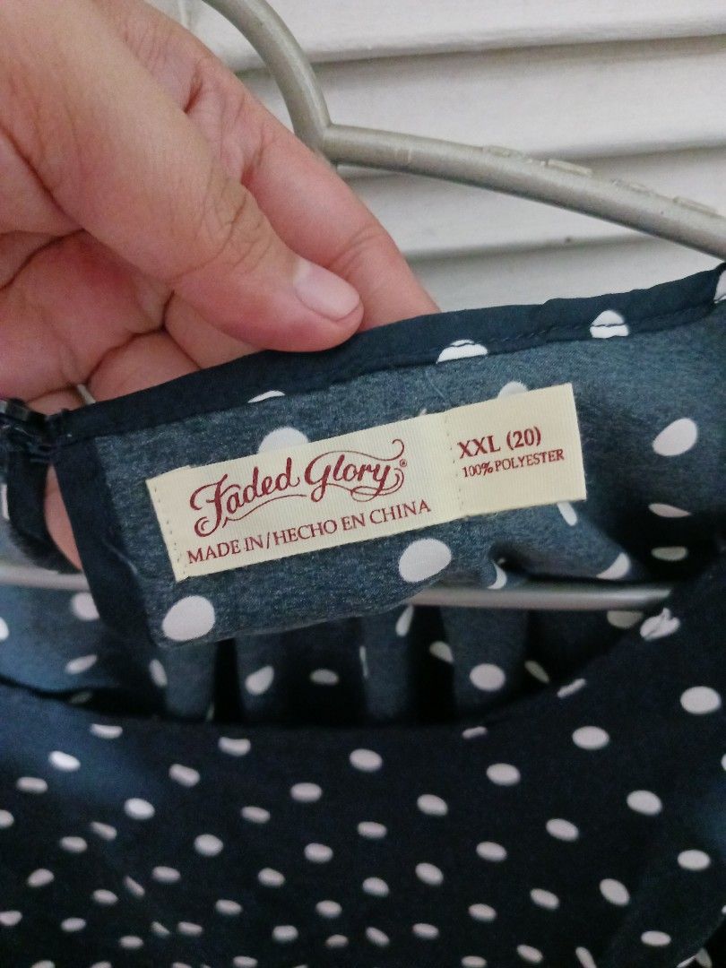 Faded Glory Navy Blue Polka Dot Blouse XXL (Category: Blouses) located in Quezon City. Submitted by rdonelle (Listing ID 1470081888, Image 2). Description: - Brand: Faded Glory - Design: Navy blue with white polka dots - Size: XXL (20) - Material: 100% lightweight polyester - Sleeves: Short sleeves - Closure: Easy slip-on with back keyhole button - Condition: Comfort fit, ideal for casual daily wear.