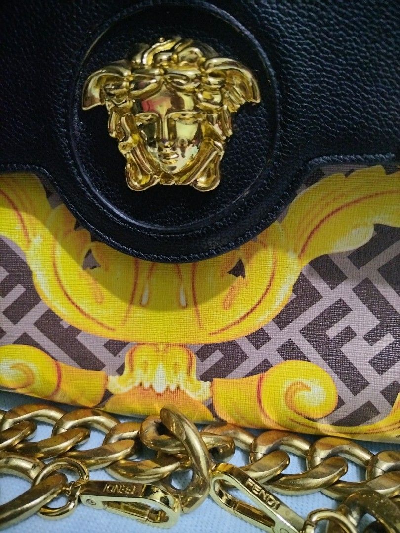 Fendace La Medusa (Category: Shoulder Bags) located in Valenzuela. Submitted by nurzdara28 (Listing ID 1469965486, Image 2). Description: Fendace La Medusa Medium Top Handle Bag. Collaboration: Part of the limited-edition Fendace collection (a collaboration between Versace and Fendi). Design Features: Black grained leather top flap combined with a yellow and brown Baroque/Zucca pattern lower section, accented with the signature gold-tone Versace 