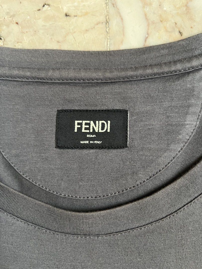 Fendi Bag Bugs Eyes T-shirt Men (Category: Tshirts & Polo Shirts ) located in San Jacinto. Submitted by rex_finds (Listing ID 1470000848, Image 3). Description: Fendi Bag Bugs Eyes T-shirt Men 100 % Authentic 💯💯💯 Complete tags with serial code Bag Bigs Eyes is leather No issue Size: Large Dimes: 18x27 inches Armpit to armpit: 21.5 inches Price is negotiable Feel free to give a reasonable offer PM for more info .