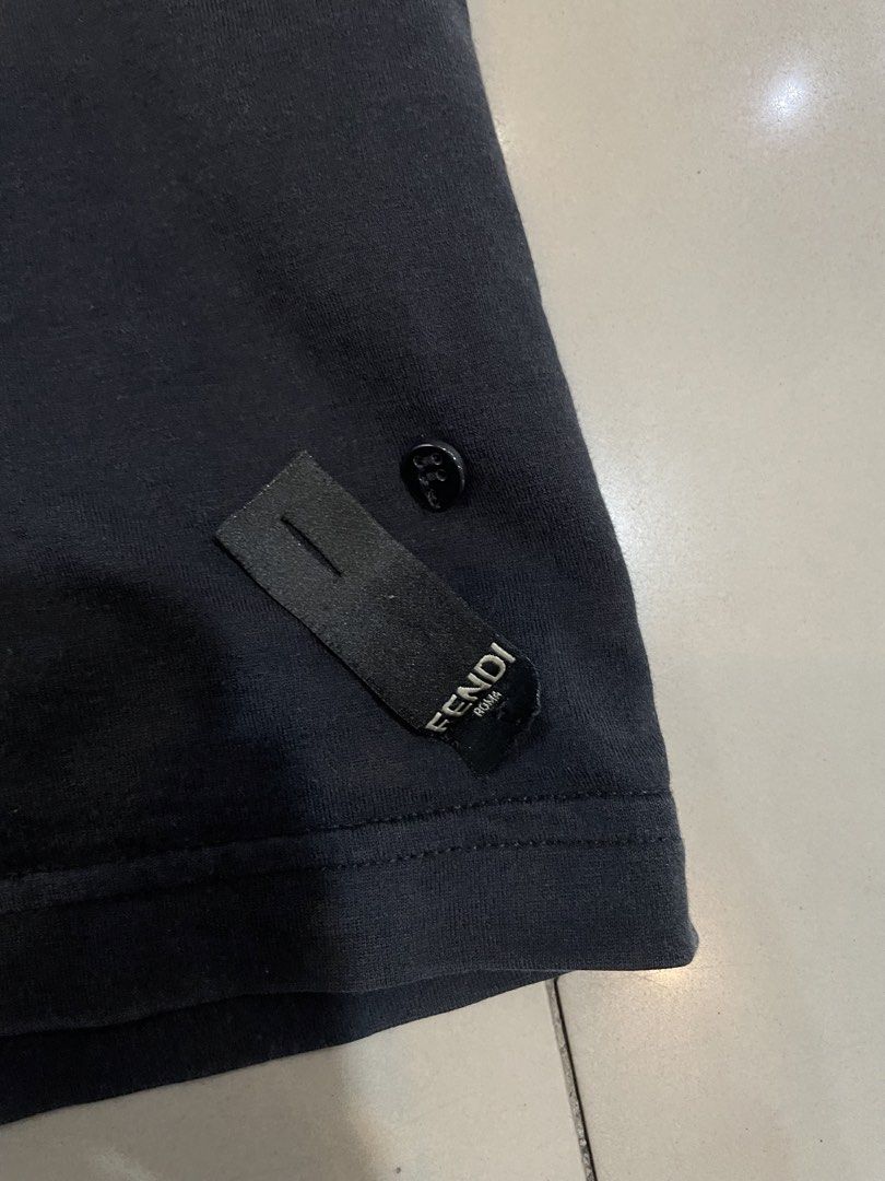 Fendi Black T-Shirt Size 50 (Category: Tshirts & Polo Shirts ) located in Cainta. Submitted by riszizlux (Listing ID 1470017675, Image 3). Description: - Color: Black - Size: 50 - Material: Premium cotton with stylish lamb leather details - Design: Standard crew neck, classic basic fit - Authenticity: Real tag and authentication label attached inside - Styling: Perfect for everyday wear, easily matches with jeans or joggers.