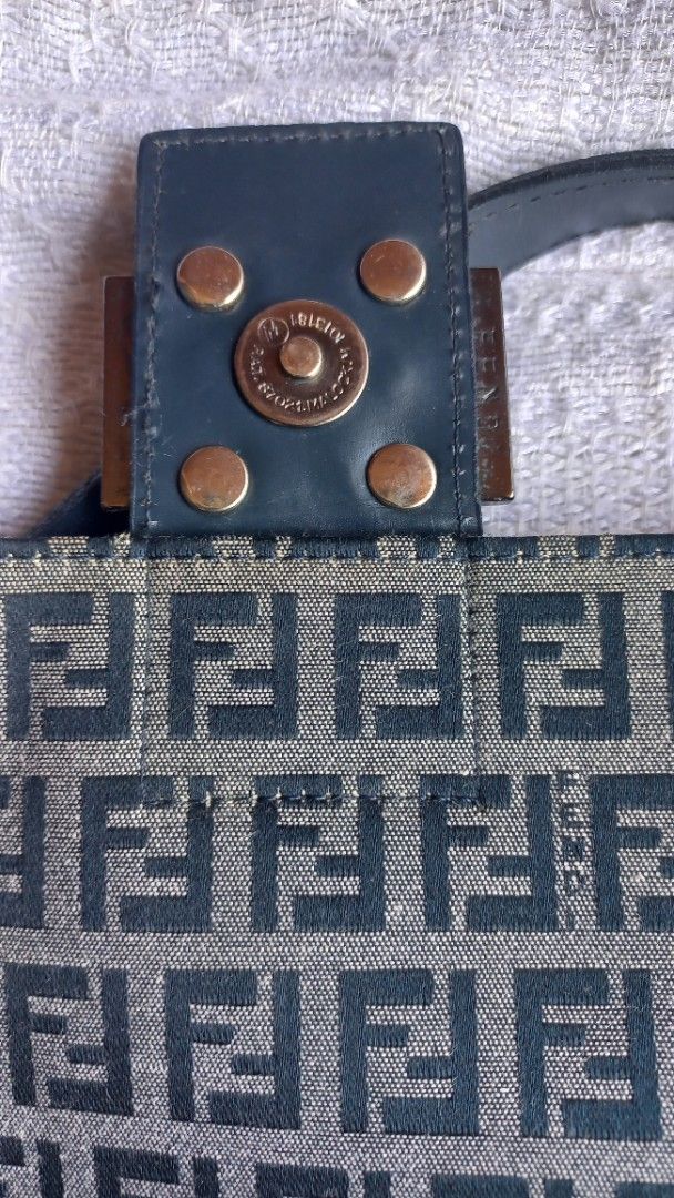 Fendi Zucca Print Canvas Shoulder Bag (Category: Luxury Bags & Wallets) located in Rizal. Submitted by mayra74 (Listing ID 1470141779, Image 3). Description: - Authentic Fendi shoulder bag with iconic Zucca monogram canvas - Features dark leather strap and buckle accent with magnetic snap closure - Secure interior zip pocket with branded hardware pullers and Fendi plaque - Compact and practical size for daily errands or night outs - Condition: Ex
