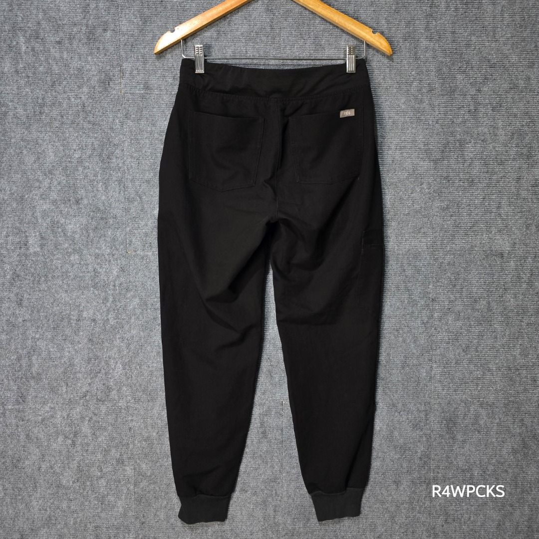 FIGS ZAMORA BLACK JOGGER SCRUB PANTS (Category: Other Bottoms) located in San Mateo. Submitted by r4wpcks (Listing ID 1470085334, Image 3). Description: Size on Tag: XS Petite Best Fit: 25 - 27 inches Waist: 25 - 29 inches Length: 35 inches Leg Hole / Hem: 3.5 inches Condition: 8.5/10 Color Rate: 9/10 Issue: Burn mark see last image COLOR MAY VARY DUE TO LIGHTING Location: San Mateo Rizal, near Marikina J&T/Lalamove courier, shipping fee should b