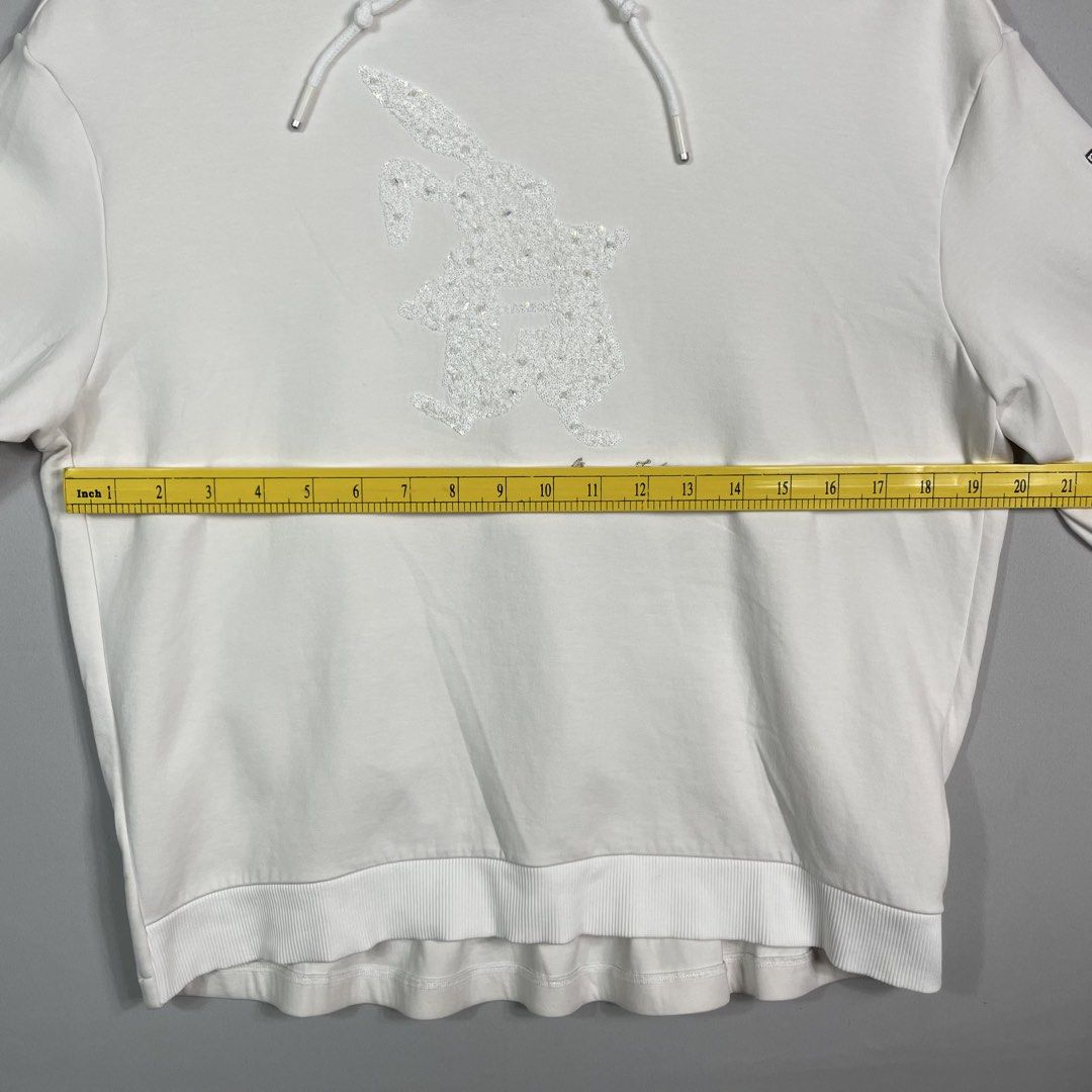 FILA | White Graphic Hoodie (Category: Hoodies) located in Manila. Submitted by sevenjscloset (Listing ID 1470005010, Image 3). Description: - Brand: FILA - Color: White with sparkly chest graphic - Size: Medium (Length: 23.5", Width: 20") - Model reference: 5'2", 50kg - Condition: Excellent, no issues, worn a few times and kept clean.
