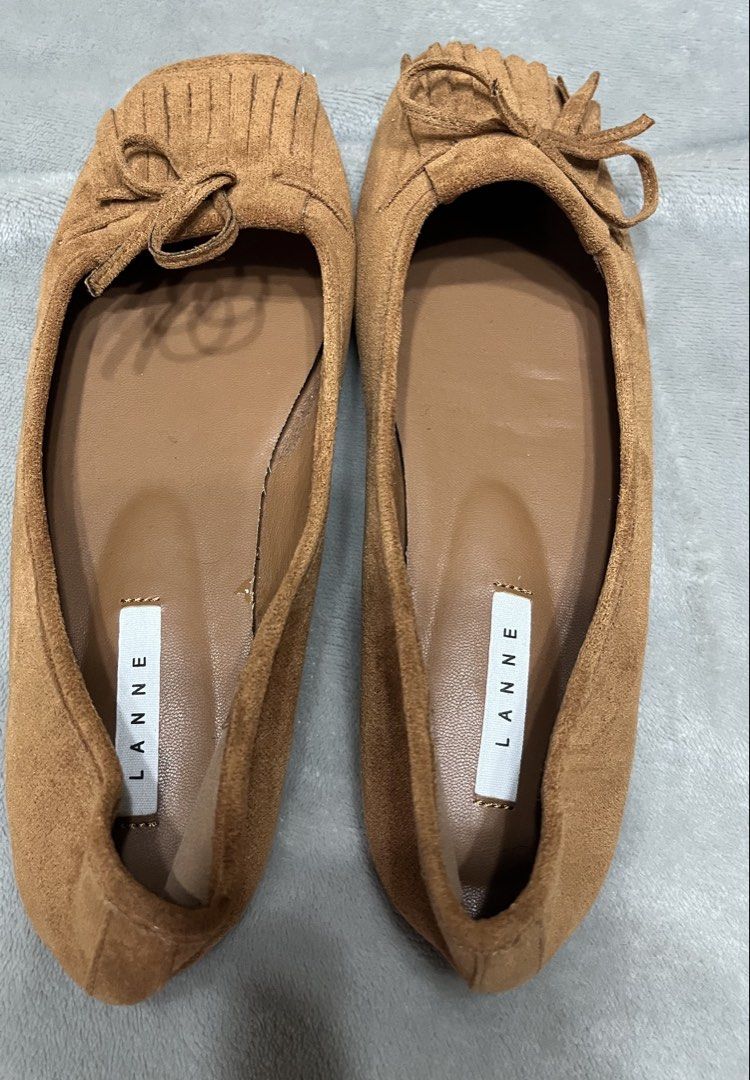 Flat shoes brown (Category: Flats & Sandals) located in Bacoor. Submitted by ayit. (Listing ID 1470042359, Image 3). Description: - Brand: Lanne Once used orig japan gling 10inches /25 cm - Color: Brown - Size: EU 38 / US 7 / UK 5 - Material: Suede-like finish with comfortable inner lining - Design: Elegant square toe with front fringe and bow detailing - Condition: Excellent pre-loved condition with protective tape on soles - Style: Versatile da