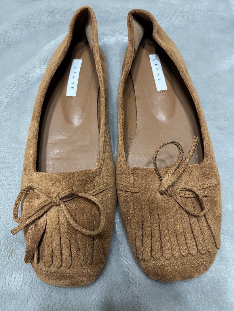 Flat shoes brown (Category: Flats & Sandals) located in Bacoor. Submitted by ayit. (Listing ID 1470042359, Image 2). Description: - Brand: Lanne Once used orig japan gling 10inches /25 cm - Color: Brown - Size: EU 38 / US 7 / UK 5 - Material: Suede-like finish with comfortable inner lining - Design: Elegant square toe with front fringe and bow detailing - Condition: Excellent pre-loved condition with protective tape on soles - Style: Versatile da