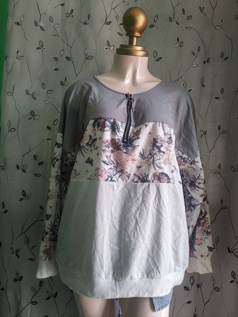 Floral pattern block sweatshirt with front zipper grey (Category: Coats, Jackets and Outerwear) located in Caloocan City. Submitted by _misskaye (Listing ID 1470042575, Image 2). Description: - Color: Grey and white with pink floral pattern - Design: Floral print across chest and sleeves - Neckline: Short zipper with trendy round pull ring - Fit: Relaxed fit with long sleeves - Details: Ribbed cuffs and bottom hem for extra comfort.