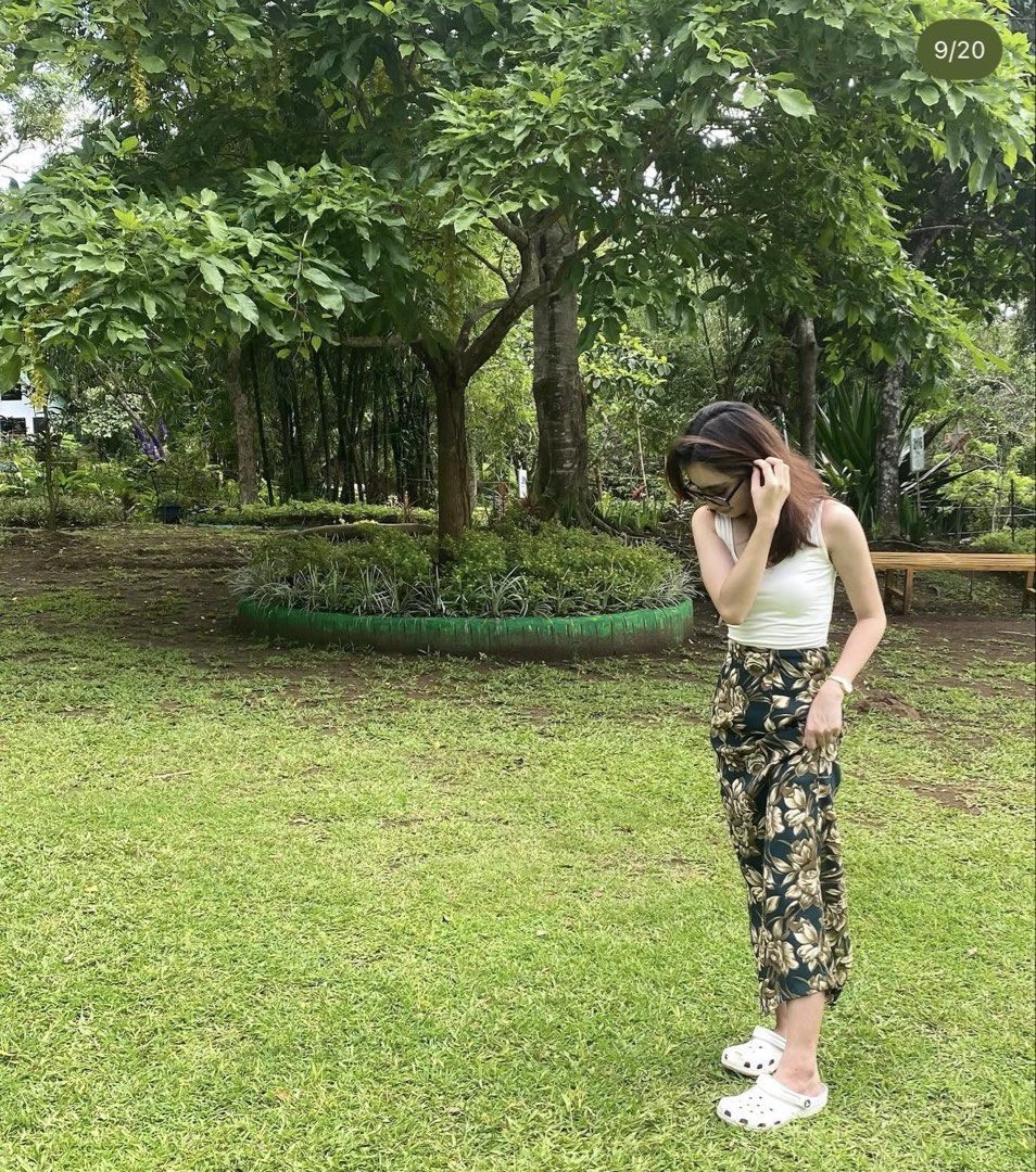 Floral pattern long skirt with dark green background (Category: Skirts) located in Manila. Submitted by plsbuymyclotheshehe (Listing ID 1469995663, Image 2). Description: - Color & Pattern: Dark green with all-over beige floral print - With slit at the back - Fit: High-waisted, ankle-length - Material: Comfortable and really excellent! .