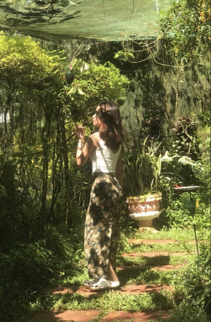 Floral pattern long skirt with dark green background (Category: Skirts) located in Manila. Submitted by plsbuymyclotheshehe (Listing ID 1469995663, Image 3). Description: - Color & Pattern: Dark green with all-over beige floral print - With slit at the back - Fit: High-waisted, ankle-length - Material: Comfortable and really excellent! .