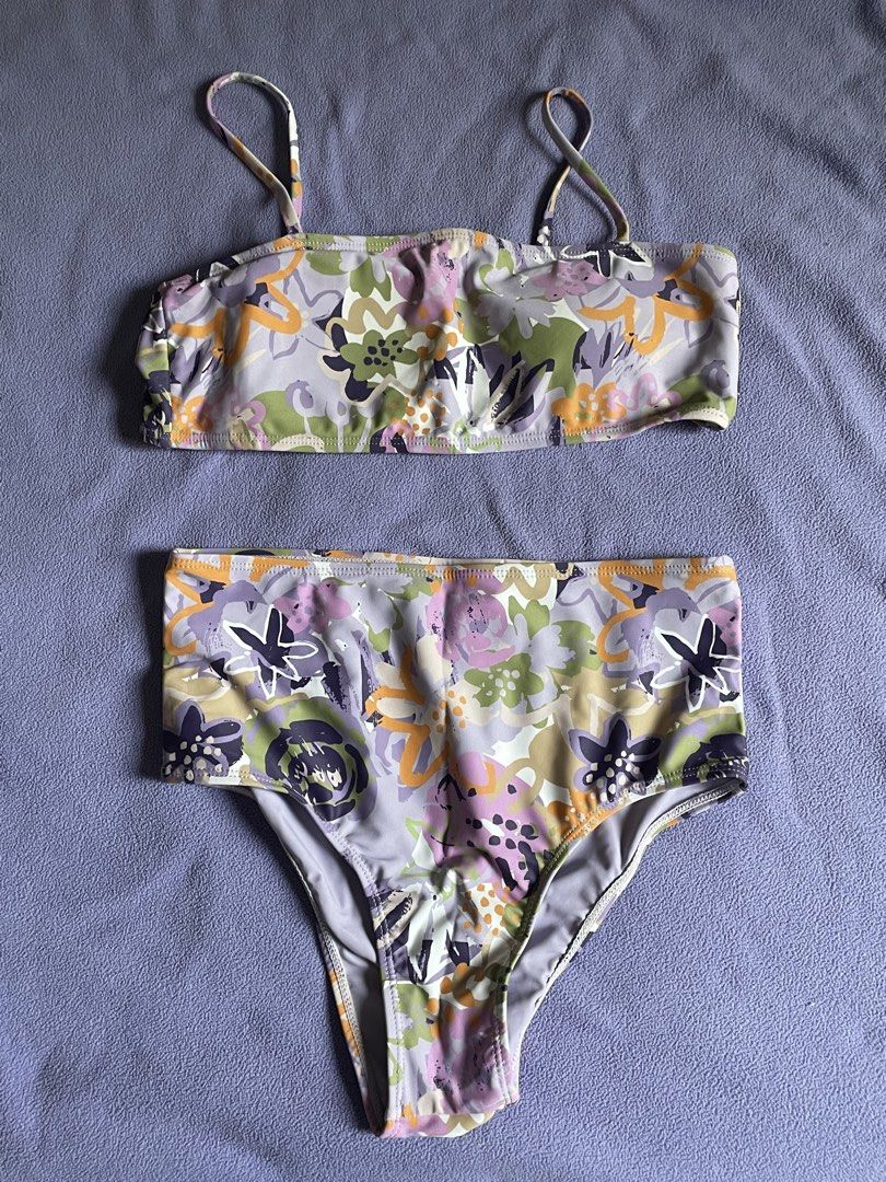 Floral Print Two-Piece Bikini Set (Category: Bikinis & Swimsuits) located in Antipolo. Submitted by chicgrc (Listing ID 1469967446, Image 1). Description: - Style: Two-piece bikini set with a cute abstract floral pattern - Colors: Soft pastel mix of purple, green, yellow, and white - Top: Bandeau style with thin adjustable shoulder straps - Bottoms: High-waisted with moderate coverage - Material: Stretchy, super comfortable for swimming or loungi