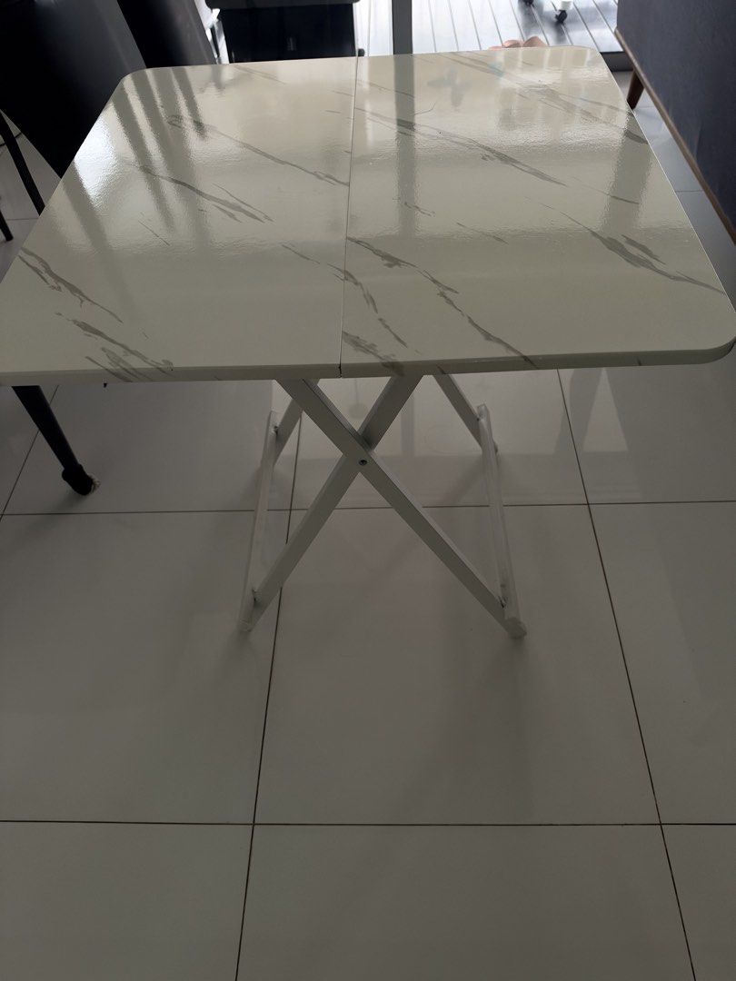 Foldable Table (Category: Tables & Sets) located in Singapore. Submitted by jochias (Listing ID 1469948671, Image 1). Description: Width 70cm Depth 70cm Height 74cm Foldable table Self collect .