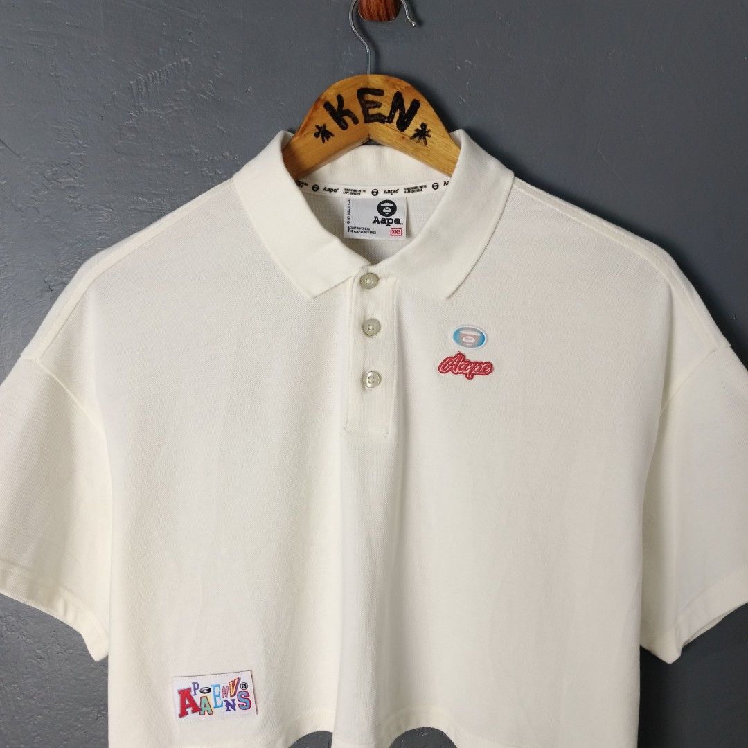 For Women - AAPE - Cropped Polo (Category: Shirts) located in Bacolod City. Submitted by drop.ph (Listing ID 1469953423, Image 3). Description: AAPE - Cropped Polo - Embroidered Authentic *Oversized Cropped Polo *Size XXS - Width - 22 , Length - 16 *Excellent Cloth *Minor stain *Price: 880php *Add SF if outside Bacolod City.
