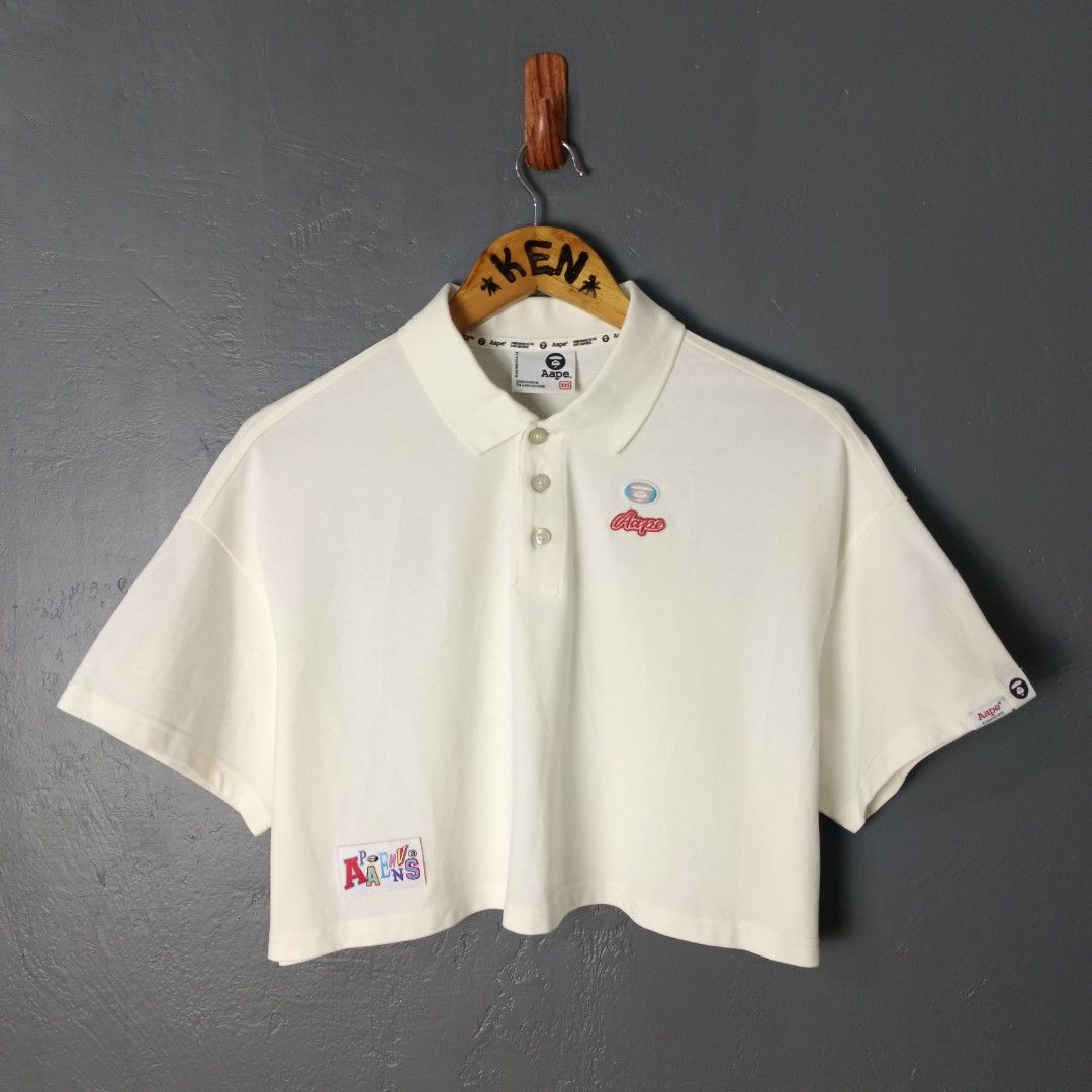 For Women - AAPE - Cropped Polo (Category: Shirts) located in Bacolod City. Submitted by drop.ph (Listing ID 1469953423, Image 2). Description: AAPE - Cropped Polo - Embroidered Authentic *Oversized Cropped Polo *Size XXS - Width - 22 , Length - 16 *Excellent Cloth *Minor stain *Price: 880php *Add SF if outside Bacolod City.