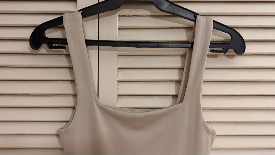 Forever 21 Beige Square Neck Bodysuit (Category: Sleeveless) located in Quezon City. Submitted by oliviablanche (Listing ID 1470085540, Image 3). Description: - Brand: Forever 21 - Size: XS - Color: Light Beige / Nude - Neckline: Square neckline with wide tank straps and square back cut - Details: Smooth, stretch fabric with a fitted silhouette and snap-button closure at the bottom - Styling: Minimalist wardrobe staple, perfect for pairing with h