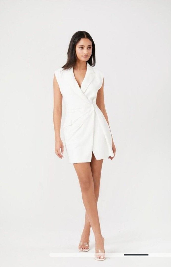 Forever 21 blazer mini dress small - medium zara mango D4 (Category: Dresses) located in San Pablo. Submitted by allyourbrandedneeds (Listing ID 1469969438, Image 1). Description: - Brand/Style: Forever 21 white sleeveless blazer dress - Design: Lapel collar, wrap front, pleated waist knot, and faux flap pocket - Material: Crisp, structured fabric in a clean white shade - Versatility: Perfect for work events, parties, or dinner dates - Styling: E