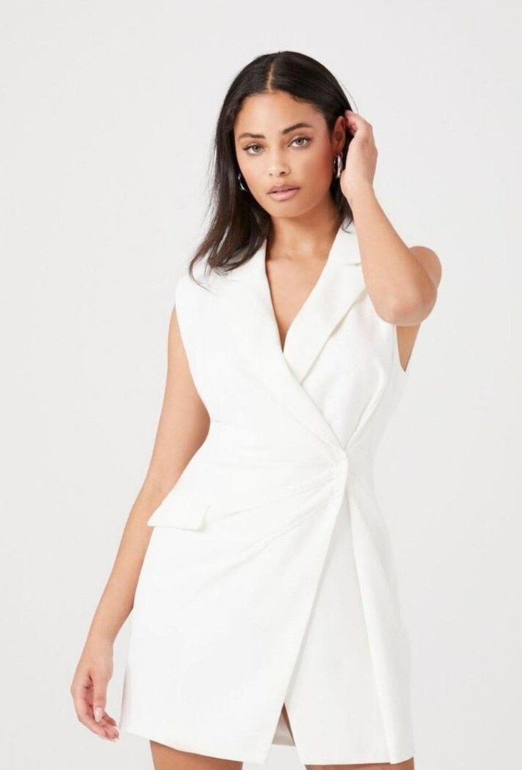 Forever 21 blazer mini dress small - medium zara mango D4 (Category: Dresses) located in San Pablo. Submitted by allyourbrandedneeds (Listing ID 1469969438, Image 2). Description: - Brand/Style: Forever 21 white sleeveless blazer dress - Design: Lapel collar, wrap front, pleated waist knot, and faux flap pocket - Material: Crisp, structured fabric in a clean white shade - Versatility: Perfect for work events, parties, or dinner dates - Styling: E