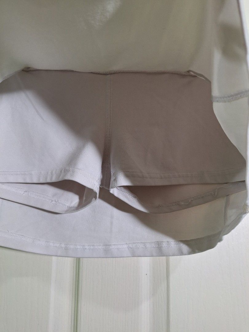 Forever 21 White Athletic Skort Size M (Category: Activewear) located in San Pablo. Submitted by allyourbrandedneeds (Listing ID 1470139392, Image 3). Description: - Brand/Model: Forever 21 Activewear Skort - Size: Medium - Color: White with contrast tape trim - Built-in shorts for extra coverage and comfort - Convenient small zipper pocket at the waistband for keys or cards - Stretchy, breathable fabric designed for easy movement - Perfect for t