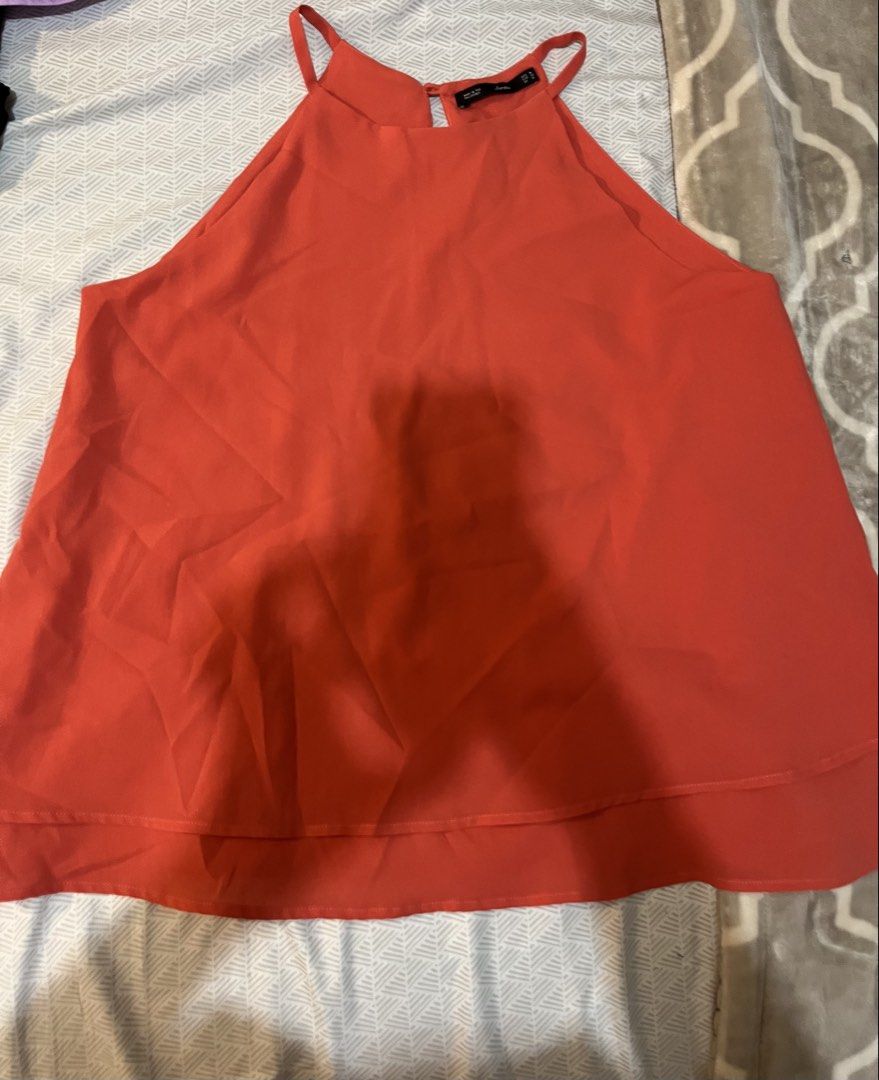 Forme Red Halter Tank Top Size M (Category: Sleeveless) located in Quezon City. Submitted by iamina16 (Listing ID 1469995304, Image 1). Description: - Brand: Forme - Size: M (EUR 38, UK 10) - Color: Bright red - Design: Halter top with spaghetti straps and double-layered flowy hem - Material: Lightweight fabric - Condition: Great for warm weather, casual outings, and easy to pair with denim shorts or skirts - Origin: Made in the Philippines.